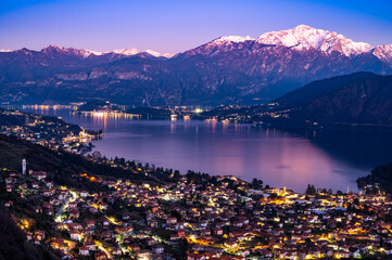 Panorama of Lake Como from Ossuccio, with Bellagio, the town of Ossuccio, and the Church of the Madonna del Socco, at dusk. - obrazy, fototapety, plakaty