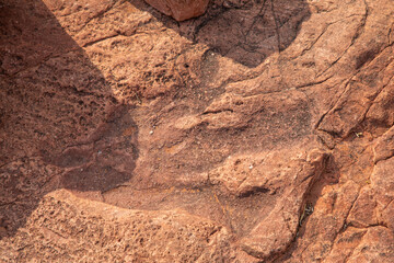 A preserved dinosaur footprint, dating from about 200 million years ago, is clearly visible in the stone on Mount Etjo in central Namibia.