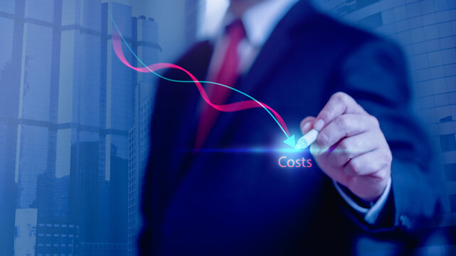 Cost reduction Concept. Businessman with his hand lowers the arrow of the graph. Cost text with a down arrow. budget,Cost Management.