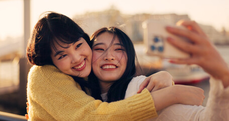 Friends, women and hug with selfie, Japanese influencer team outdoor with memory and social media...