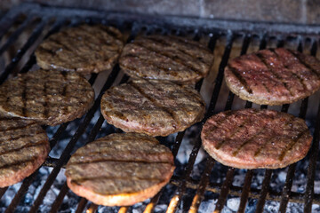 Real Burgers grilling on the barbecue.