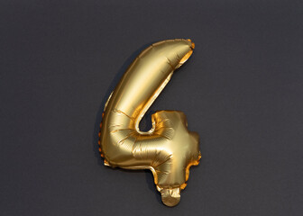 Numbers 4, 40, 42 gold balloons on a black background