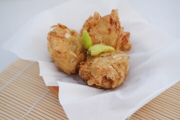 Bakwan sayur or vegetable fritter, Indonesian snack made from flour, cabbage, carrots and bean sprouts, served with chili