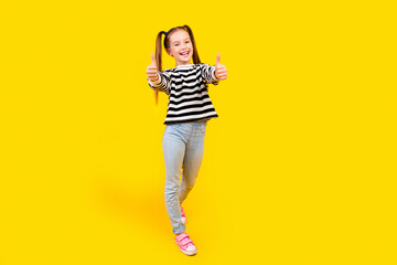 Photo of charming cool small kid wear striped sweater smiling showing two thumbs up empty space...