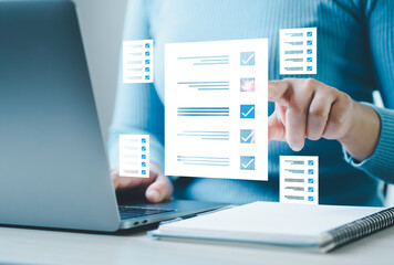 Business performance checklist, businessman using laptop doing online checklist survey, Check marks...