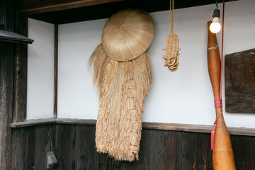 Japanese sandals, cape and hat handmade from straw from the countryside of the Niigata region in...
