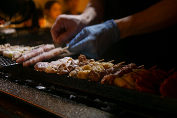 Grilled yakitori chicken skewers at an Izakaya restaurant in Omoide Yokocho street in the Shinjuku district of Tokyo.