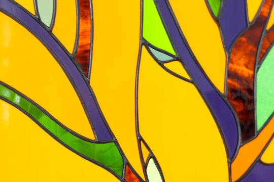 Colorful stained glass fragment, close up