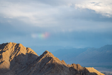 Fototapeta na wymiar Rainbow over the mountains, Himalayas, Ladakh, India, Tibetan Buddhism
