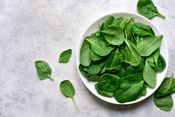 Fresh spinach leaves. Top view with copy space.