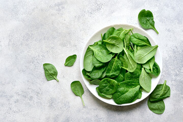 Fresh spinach leaves. Top view with copy space.