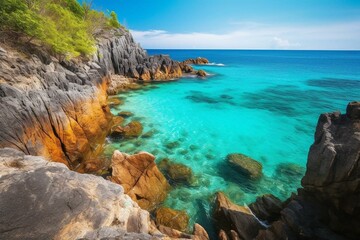 Fototapeta na wymiar Scenic coastal view of clear turquoise ocean and rocky terrain. Generative AI