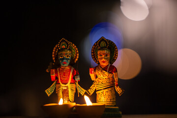Hindu god ram and goddess sita idol made with wooden on display at temple to worship on diwali....