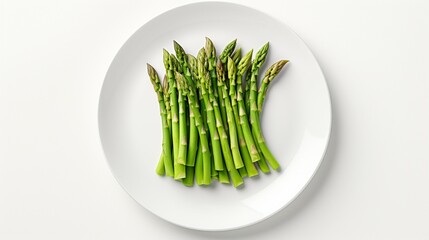 On a white background, on a white plate, green asparagus. Top view.




