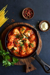 Meatballs with rice in tomato sauce. Top view with copy space.