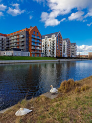 Gdansk, Poland  March 26, 2023: architecture of a modern city on the river bank. Gdansk, Poland