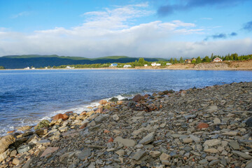 scenic sandy empty coast at Nova Scotia in Canada with view to coastal landscape