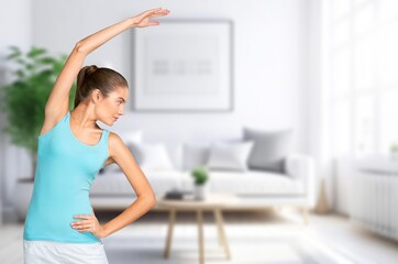 Fototapeta na wymiar Young happy woman do yoga in living room