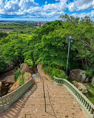 Salto,SP, Brazil - Jan 21, 2024. View of the stairs of Our Lady of Mont Serra and the city of Salto. In addition to the vegetation around the stairs on a sunny day.