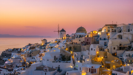 Sunset in the Greek village of Oia Santorini with a view of the caldera in the sea, Greece 