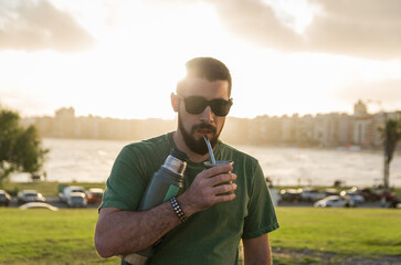 Man drinking chimarrão, mate (an infusion of yerba mate with ho - 715804131