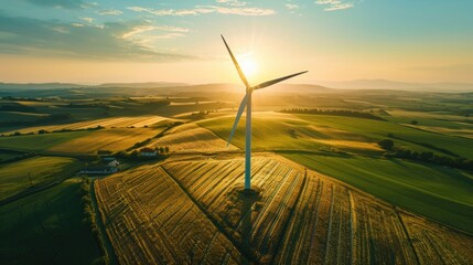 Wind Turbine in Golden Fields at Sunset for Renewable Energy - obrazy, fototapety, plakaty
