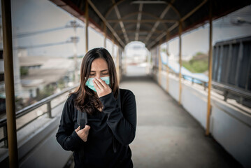 Fototapeta premium Asian traveler woman wear mask for protect coronavirus,Thai woman wearing face mask respiratory protect and filter pm2.5 (particulate matter)