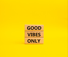 Naklejka premium Good Vibes only symbol. Concept words Good Vibes only on wooden blocks. Beautiful yellow background. Business and Good Vibes only concept. Copy space.