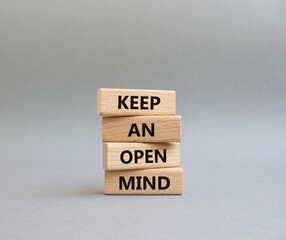 Keep an open mind symbol. Wooden blocks with words Keep an open mind. Beautiful grey background. Business and Keep an open mind concept. Copy space.