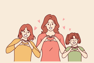 Congratulations on women day from women of different ages showing heart gesture and congratulating you on march 8th. Mom and daughters celebrate international women day or take pride in family unity