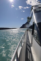Lateral view of boat on sunny day sailing lago argentino
