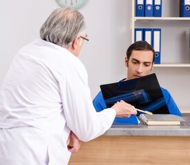 Two doctors talking at the reception in hospital