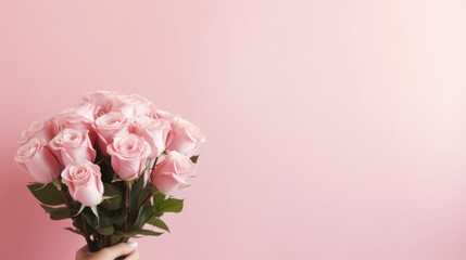 A bouquet of pink roses in women's hands for congratulations on Mother's Day, Valentine's Day, Women's Day. Blurred background.