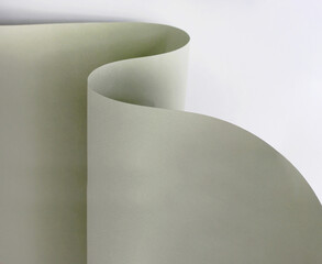 curved sheet of paper close-up. creative neutral background or texture