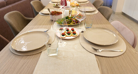 Table served for festive dinner in living room