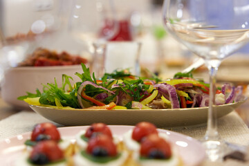 Lady bug cracker with cream cheese and tomato on festive table