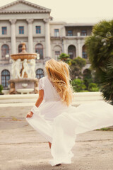 Fototapeta na wymiar Beautiful happy running bride outdoors