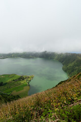 The lake Lagoa das Sete Cidades is located in the crater of a volcano on the island of Sao Miguel,...