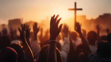Foto op Canvas Christian worshipers raising hands up in the air in front of the cross © IBEX.Media