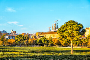 Barcelona, Spain - December 21, 2023: A city park with La Sagrada Familia in the background in...