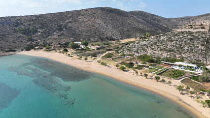 Aerial drone photo of paradise sandy beach of Livadi next to abandoned ruins of castle of Iraklia island, Small Cyclades islands, Greece