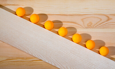 Abstract still life with balls on a wooden board