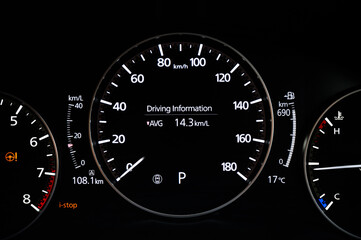 Digital car dashboard with tachometer, speedometer, driving distance, the temperature outside the car, and total distance driven on fuel 1 tank.