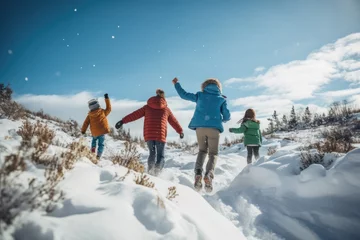 Fotobehang Energetic children and their guardian throw snow into the air, playing joyfully on a bright, snowy hillside © gankevstock