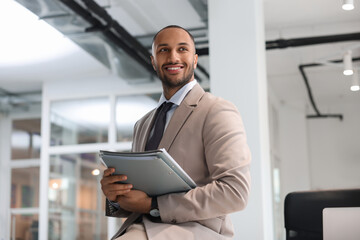 Fototapeta premium Happy man with folders in office. Lawyer, businessman, accountant or manager
