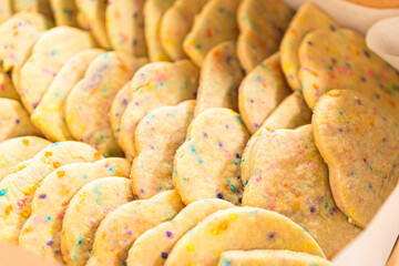 Packing Sprinkle-Adorned Sugar Cookies into Boxes