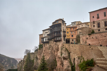 Fototapeta na wymiar Hanging house on the cliff with wooden balconies in Cuenca, Spain