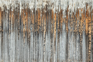 Detail of old weathered wooden planks barn wall with rough texture