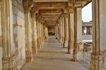 Stone Columns and beams corridor of Mosque in Sarkhej Roza, Ahmedabad, India © AbhishekKumar