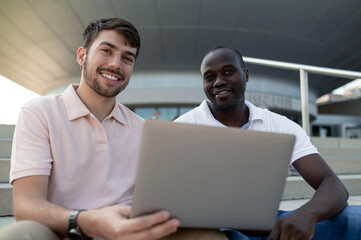 Two colleagues working together remotely and looking involved